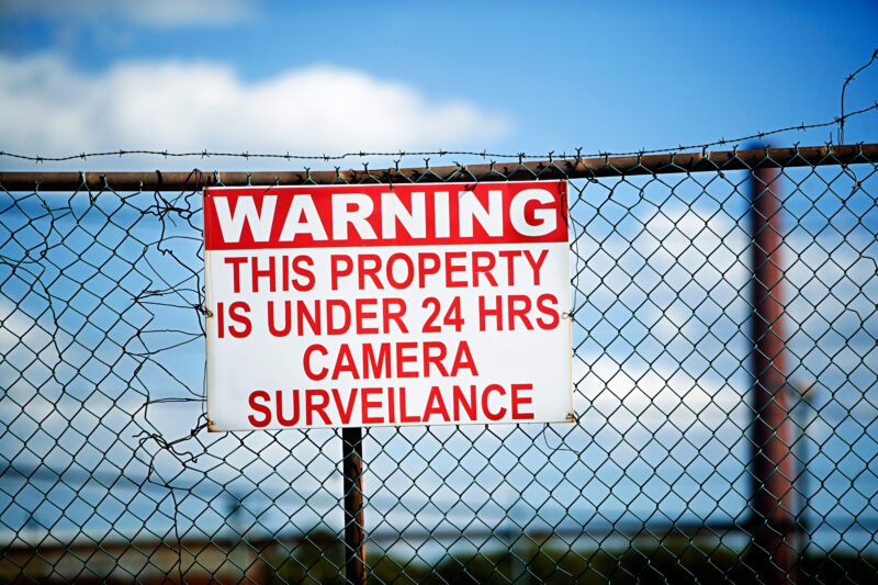 Warning sign on fence